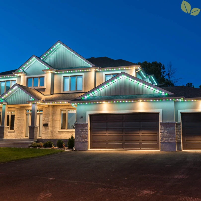 Permanent LED lighting installed along roofline of modern residential home