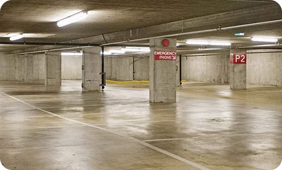 Clean underground parking garage with polished concrete floor